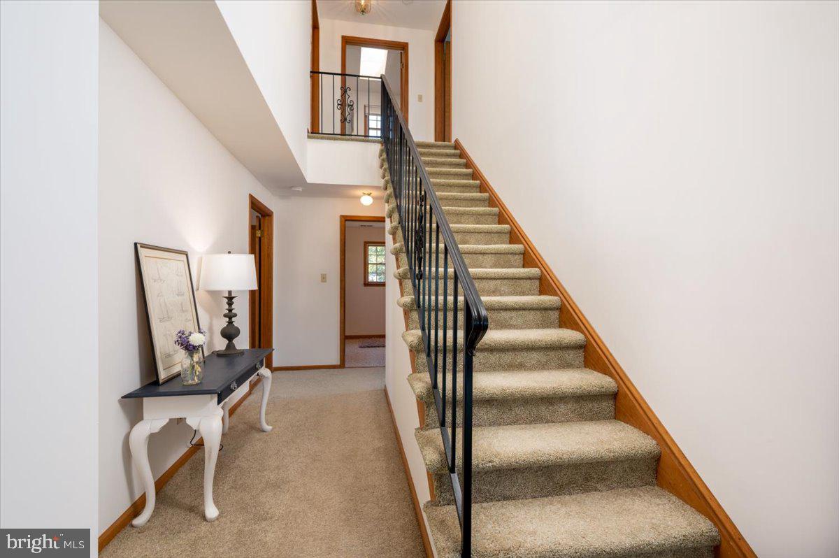 8236 Bayside Road Chesapeake Beach, MD 20732 - Photo 17 of 39 a view of an entryway with staircase