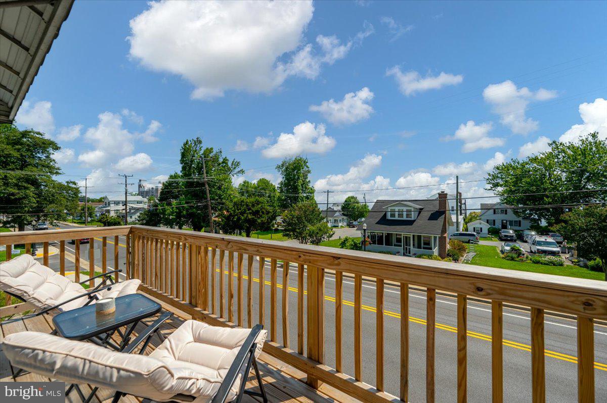 8236 Bayside Road Chesapeake Beach, MD 20732 - Photo 3 of 39 a view of a chairs and table in the balcony