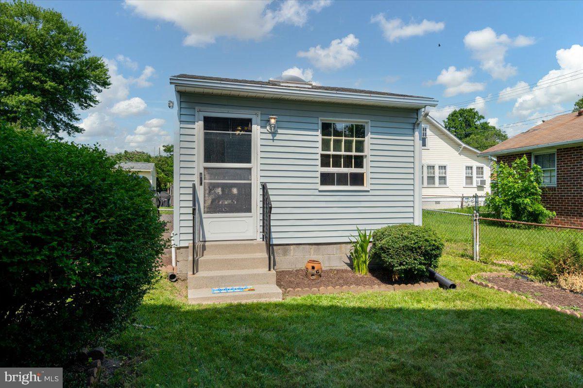 8236 Bayside Road Chesapeake Beach, MD 20732 - Photo 35 of 39 a front view of a house with a yard