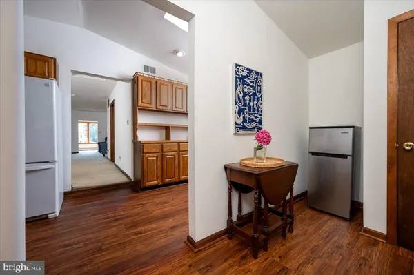 a room with furniture and wooden floor