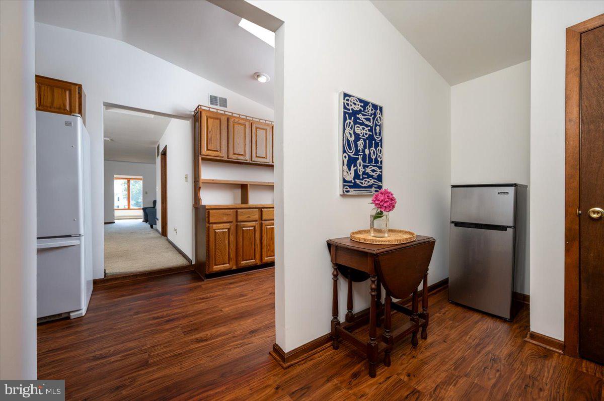 8236 Bayside Road Chesapeake Beach, MD 20732 - Photo 5 of 39 a room with furniture and wooden floor