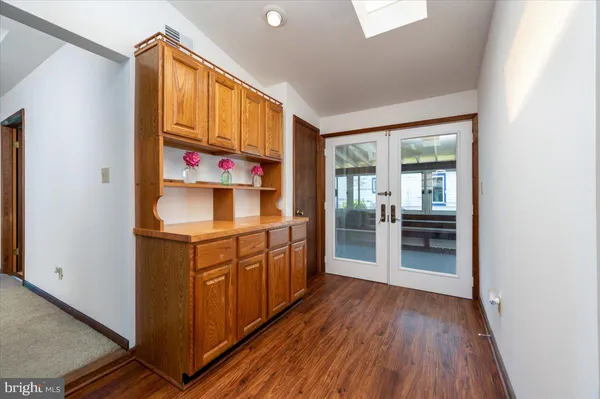 a kitchen with stainless steel appliances granite countertop a sink and cabinets