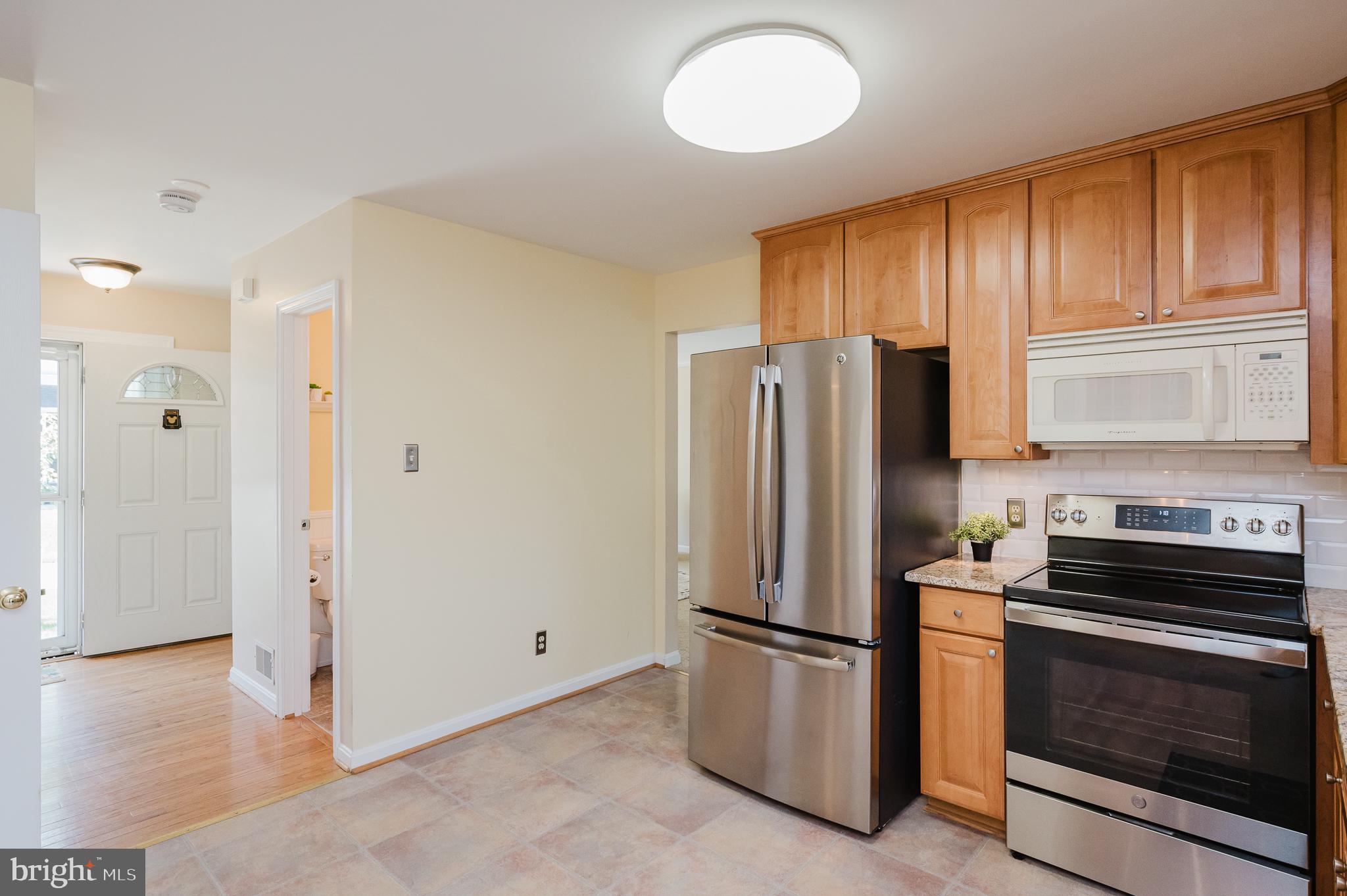 4 Kings Place Nottingham, MD 21236 - Photo 23 of 55 Modern kitchen with sleek stainless appliances.