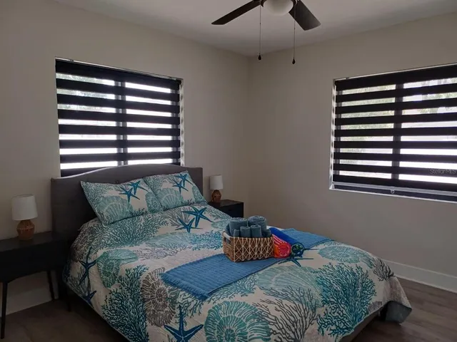 a view of a storage and utility room with washer and dryer