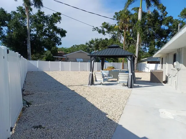 a view of a house with backyard