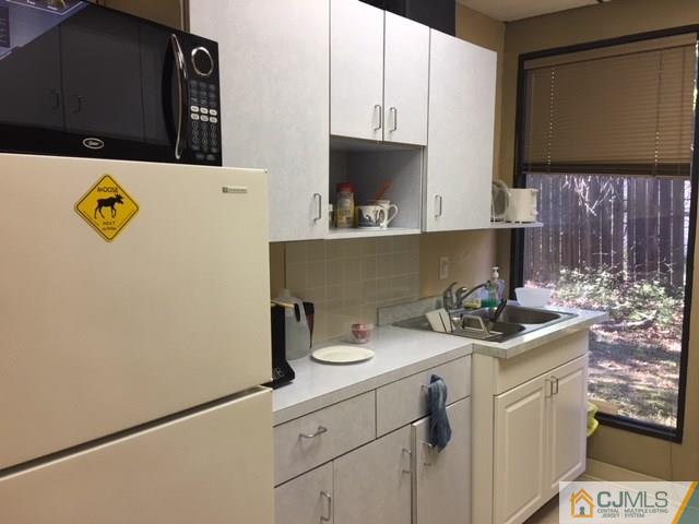 1381 Highway 1 Edison, NJ 08837 - Photo 11 of 11 a kitchen with a sink a stove and cabinets