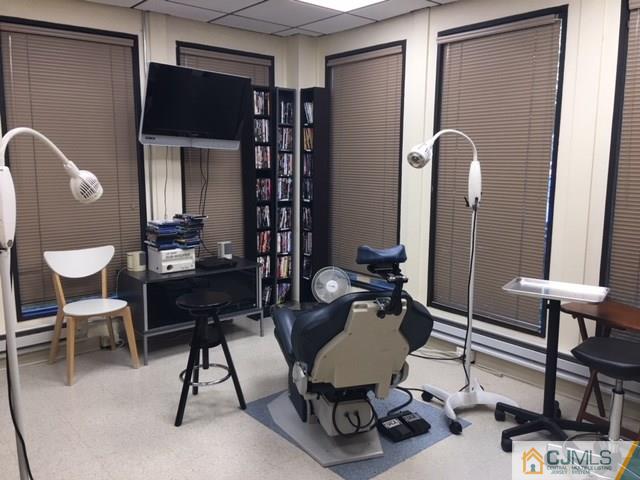 1381 Highway 1 Edison, NJ 08837 - Photo 3 of 11 a work room with furniture and wooden floor