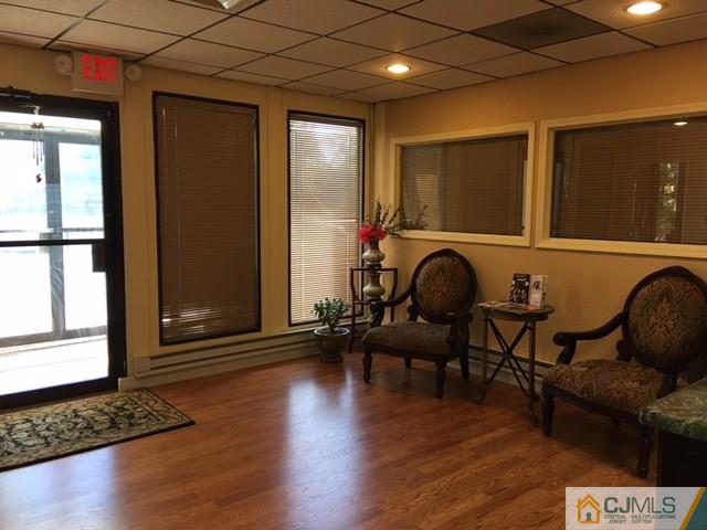 1381 Highway 1 Edison, NJ 08837 - Photo 6 of 11 a living room with furniture and a window