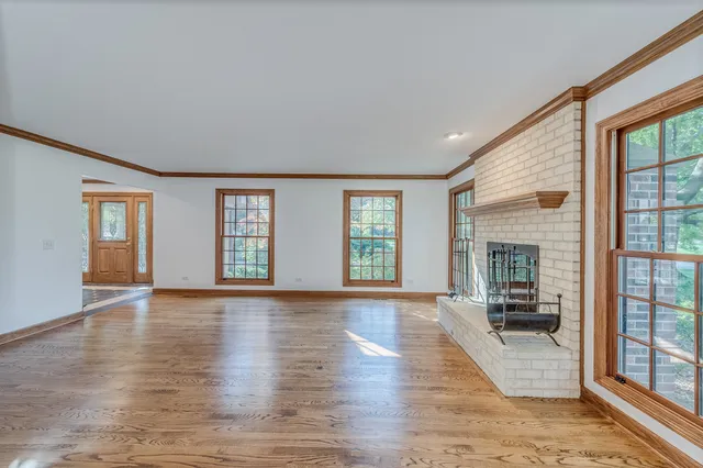 a view of an entryway with wooden floor