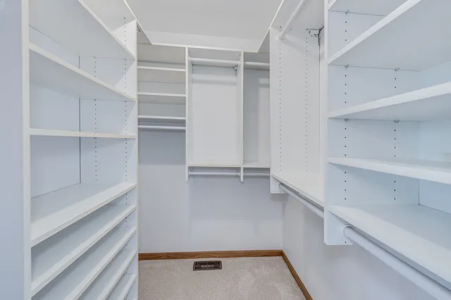 a bathroom with a granite countertop sink mirror and shower