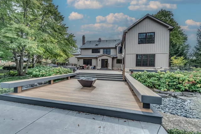 a house with swimming pool in front of it