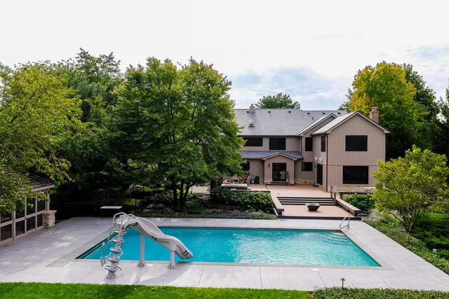 an aerial view of a house with outdoor space