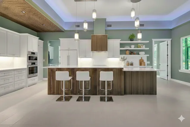 a kitchen with stainless steel appliances a refrigerator and a stove top oven