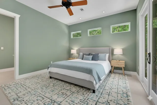 a view of a house with a garage and balcony