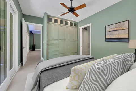 a view of a house with a garage and balcony