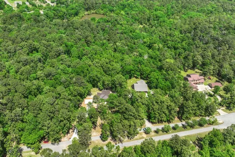 a view of a lake with a yard