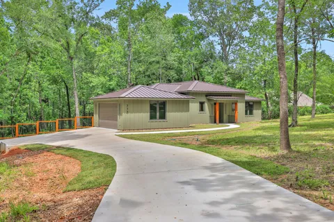 a view of a house with a tree