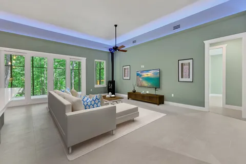 a living room with furniture and a large window