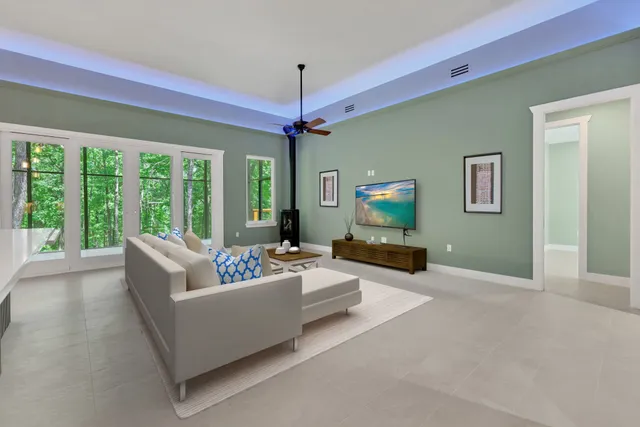 a living room with furniture and a large window