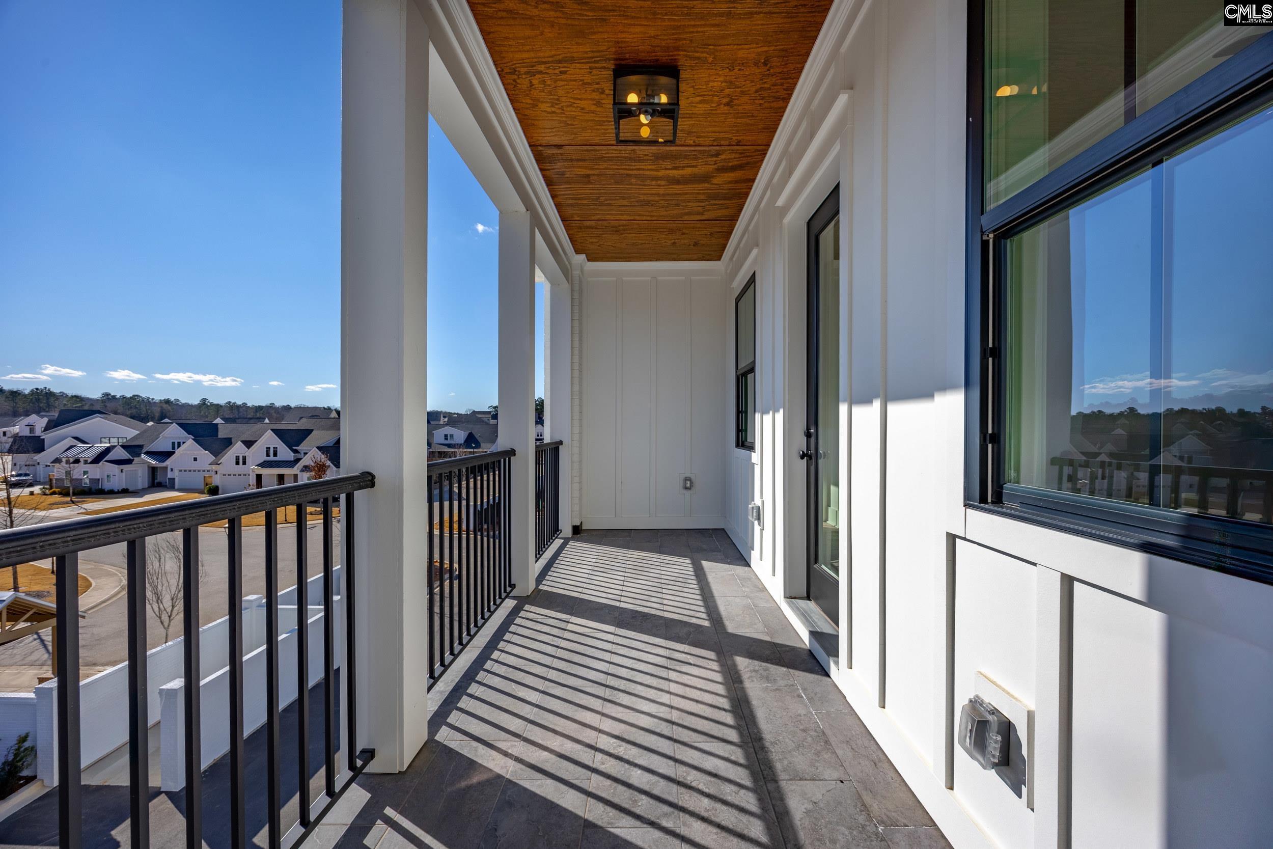 1318 Long Grove Way Lexington, SC 29072 - Photo 72 of 90 a view of a balcony with wooden floor and stairs