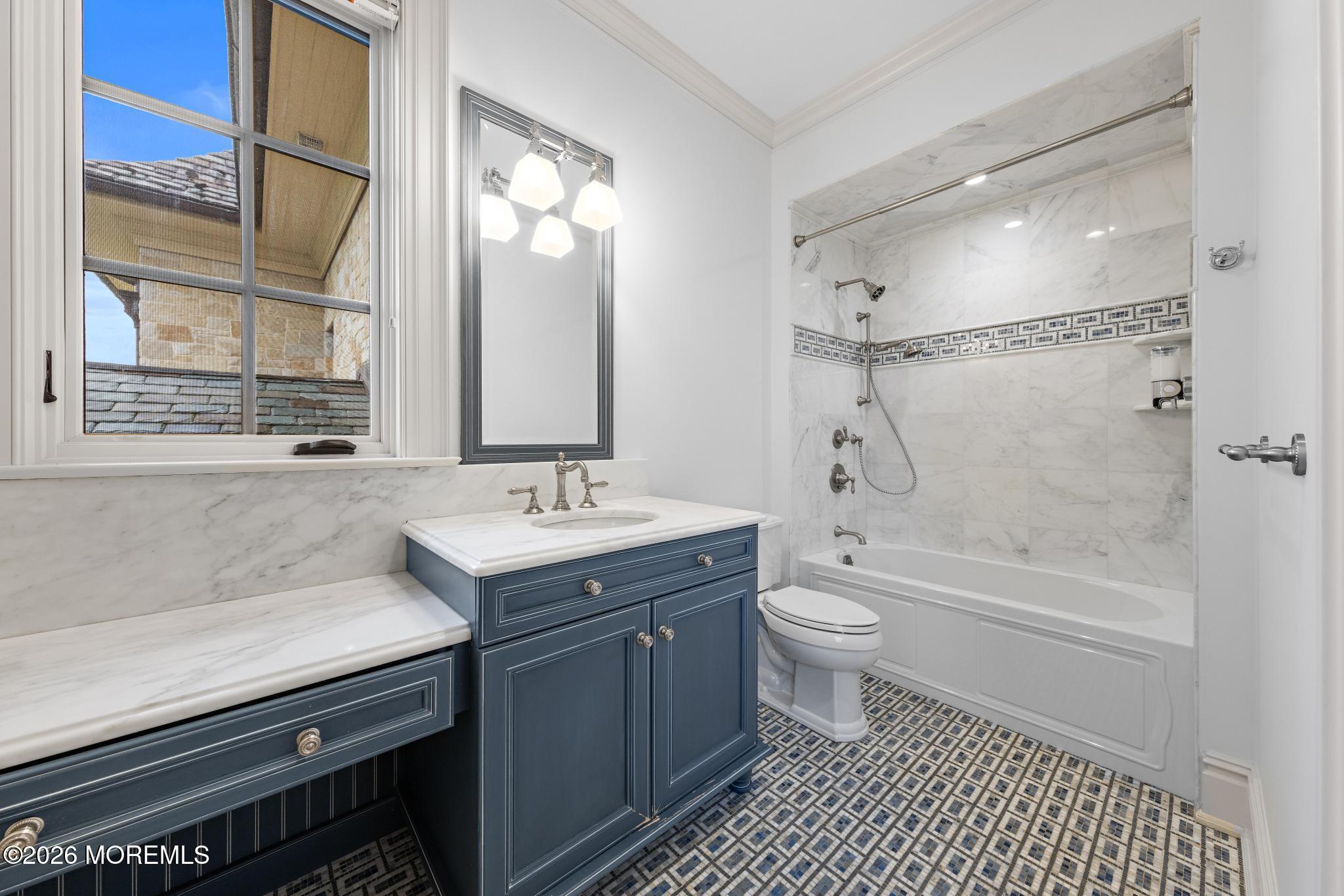 88 Montrose Road Colts Neck, NJ 07722 - Photo 37 of 73 a bathroom with a granite countertop sink toilet a large mirror a bathtub and shower