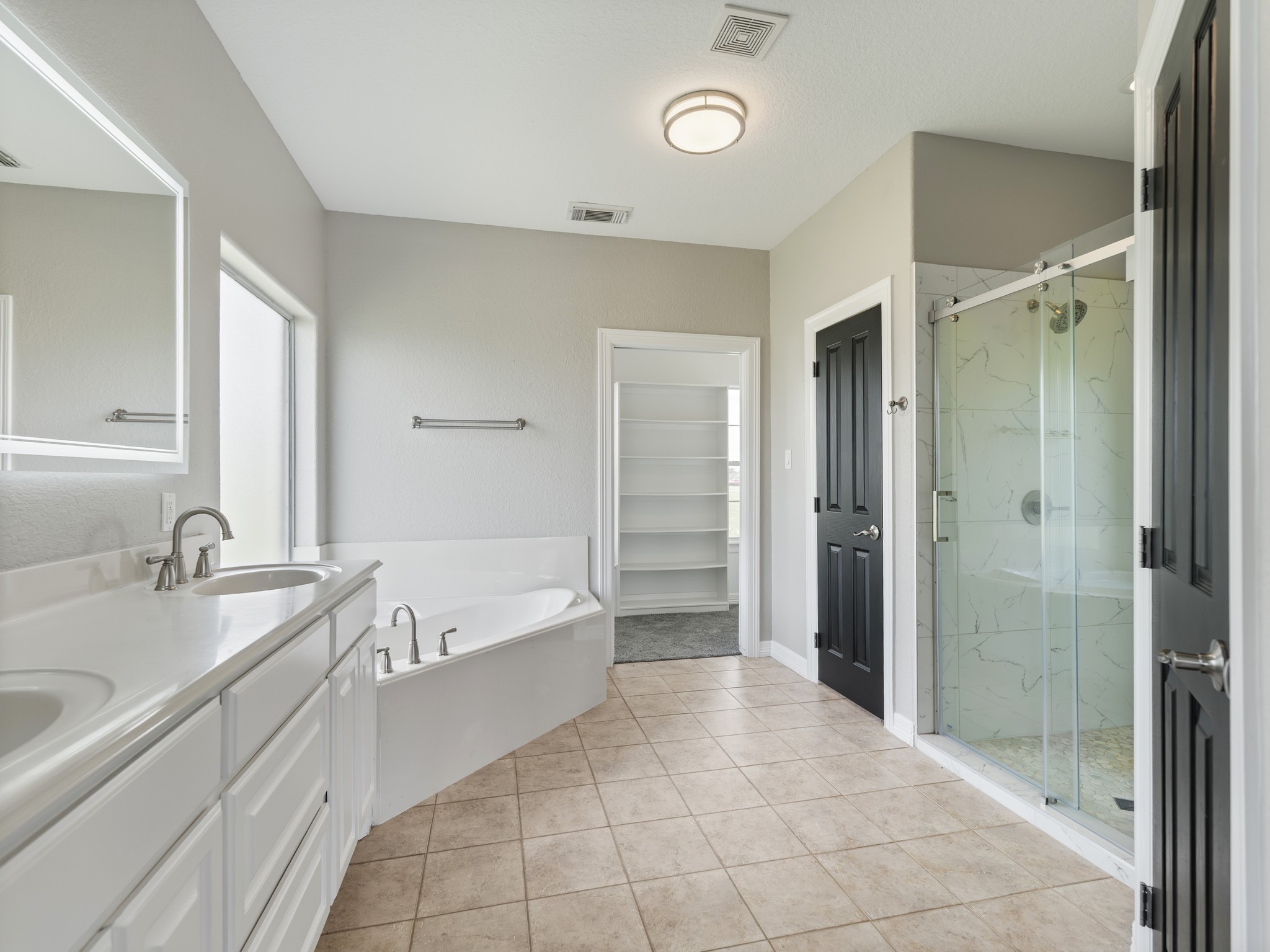863 Bunkhouse Trail Angleton, TX 77515 - Photo 21 of 42 Soaking tub, separate shower, double vanity, and a private water closet