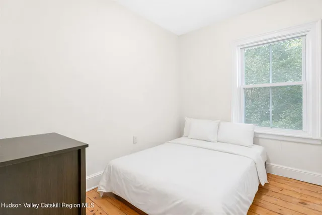 a view of empty room with floor to ceiling window
