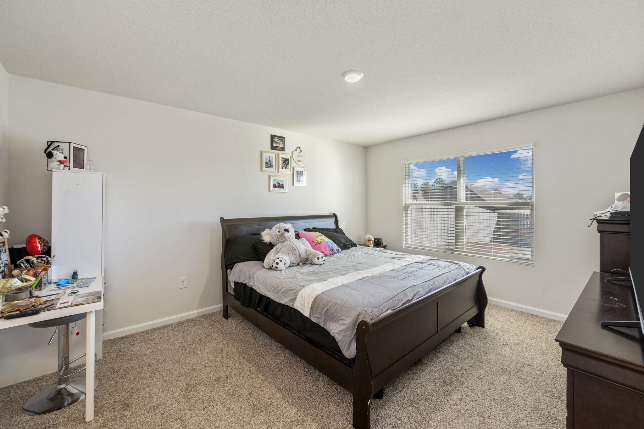 4735 Airmen Drive Crestview, FL 32539 - Photo 11 of 29 a bedroom with a bed and a flat screen tv