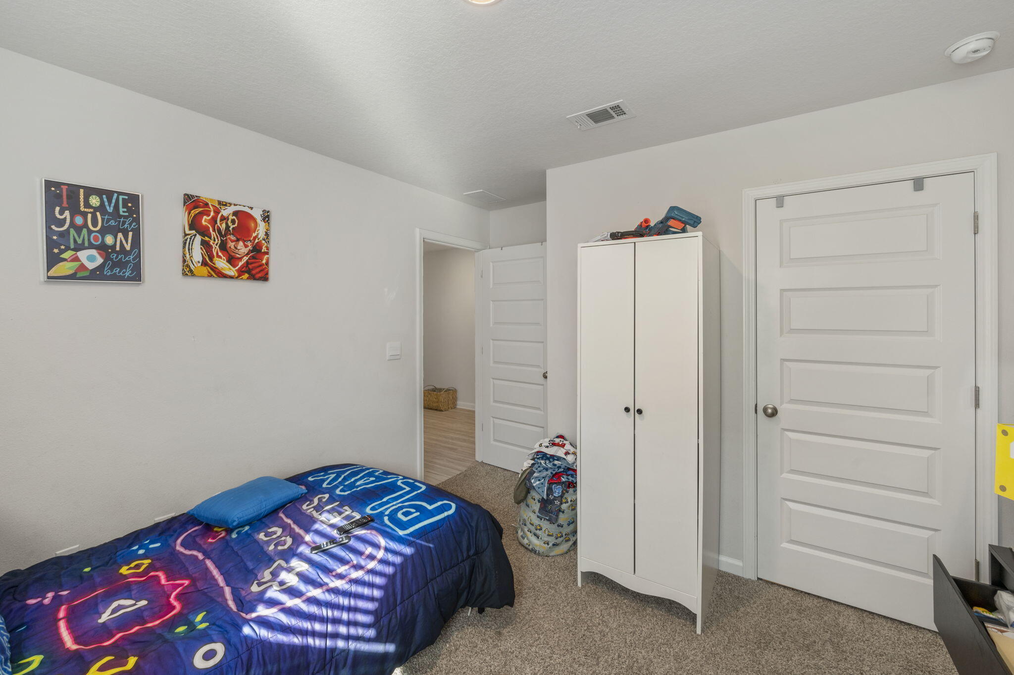 4735 Airmen Drive Crestview, FL 32539 - Photo 15 of 29 a bedroom with a bed and a closet
