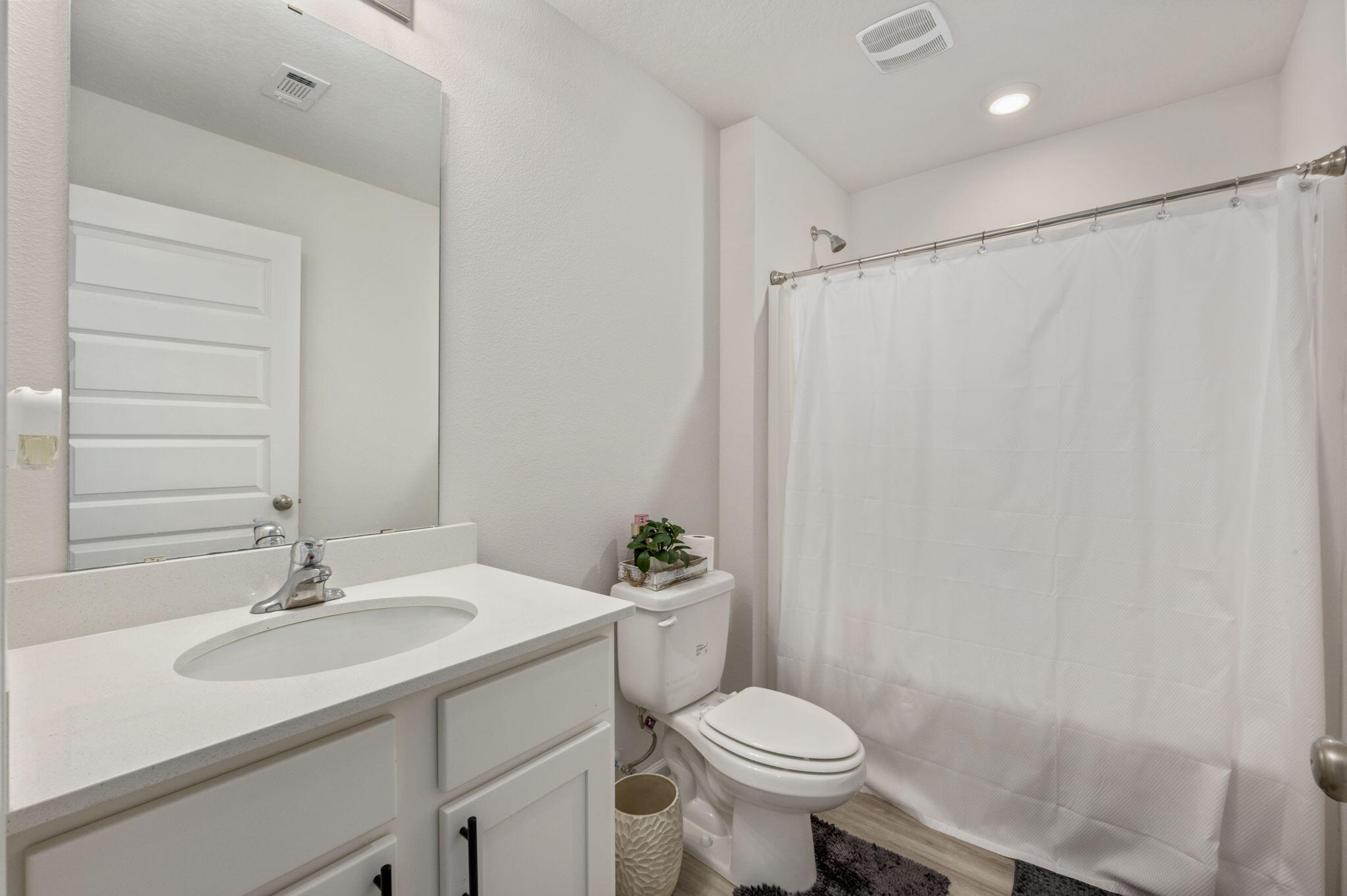 4735 Airmen Drive Crestview, FL 32539 - Photo 18 of 29 a bathroom with a sink toilet and a mirror