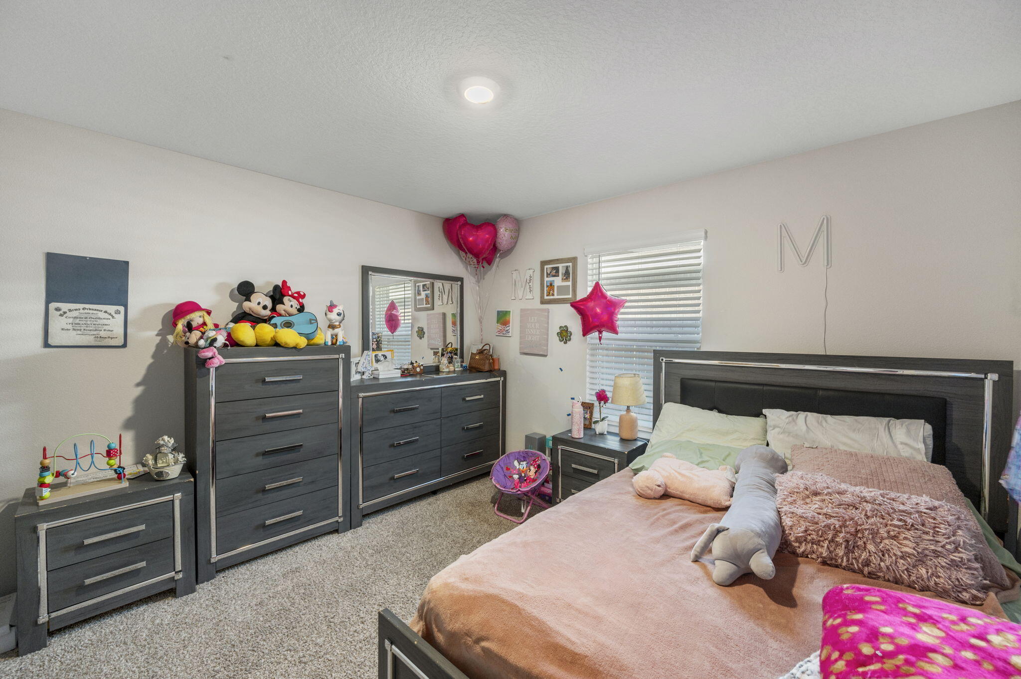 4735 Airmen Drive Crestview, FL 32539 - Photo 20 of 29 a bed room with a bed and a couch