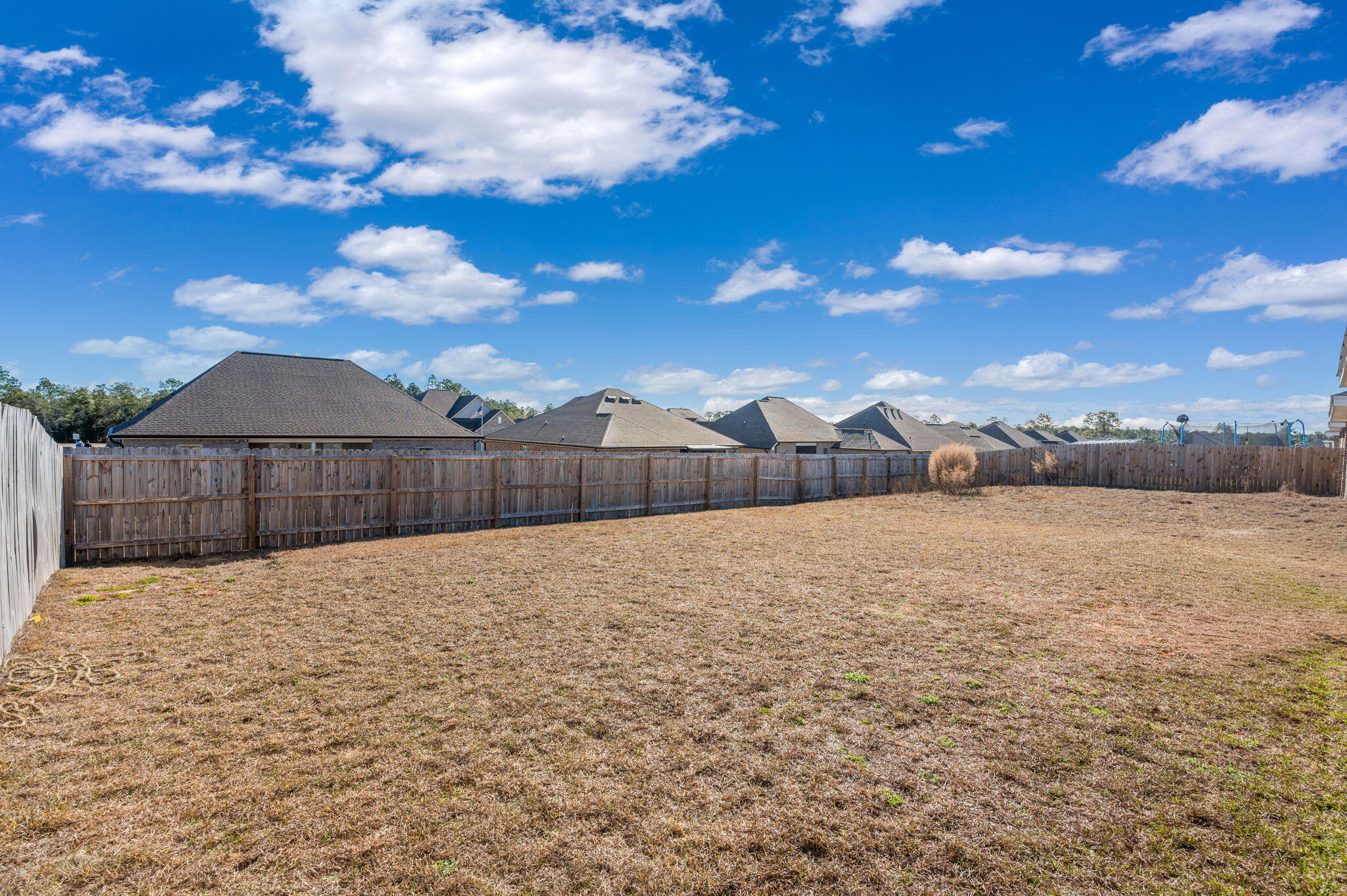4735 Airmen Drive Crestview, FL 32539 - Photo 26 of 29 a street view with wooden fence