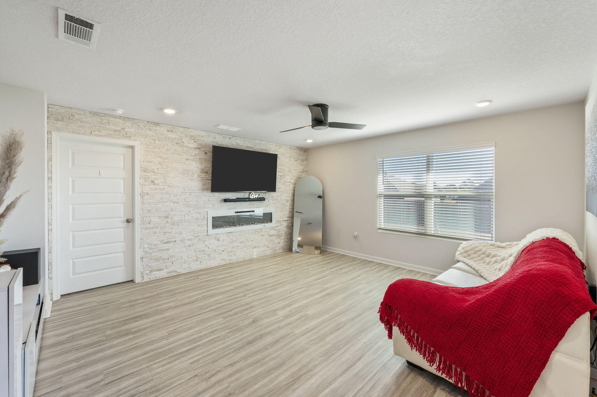 4735 Airmen Drive Crestview, FL 32539 - Photo 3 of 29 a view of a livingroom with furniture and a flat screen tv