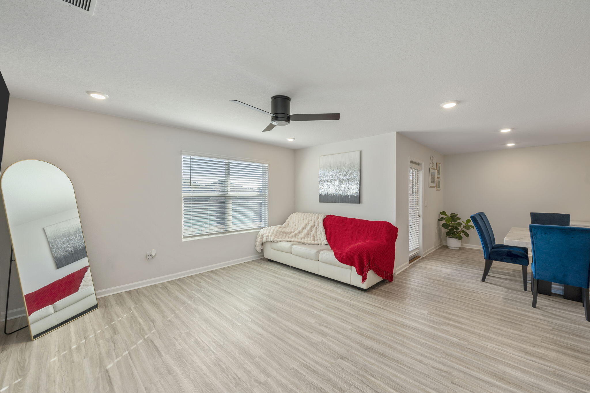 4735 Airmen Drive Crestview, FL 32539 - Photo 9 of 29 a living room with furniture and wooden floor