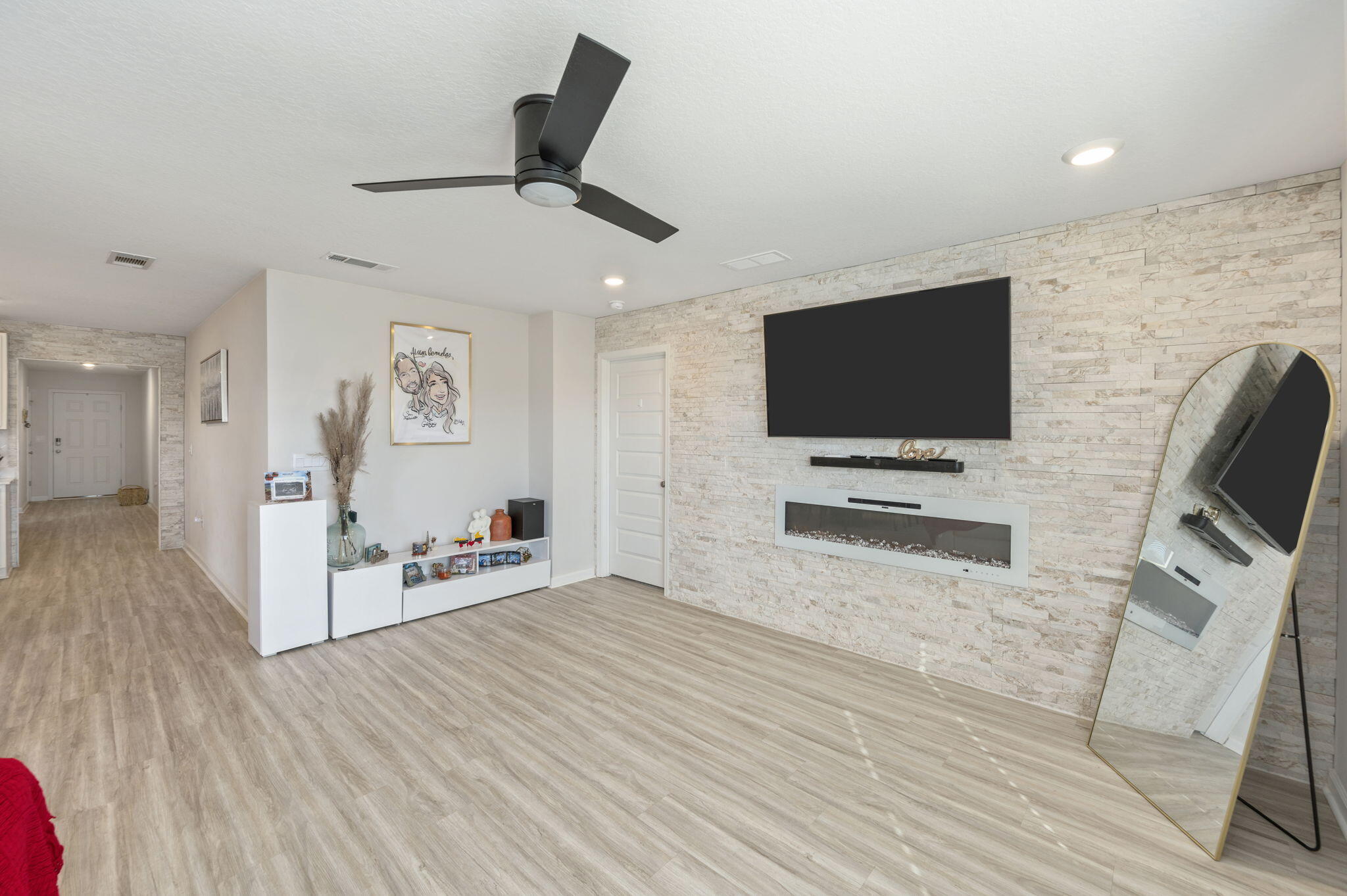 4735 Airmen Drive Crestview, FL 32539 - Photo 10 of 29 a view of a livingroom with furniture and a flat screen tv