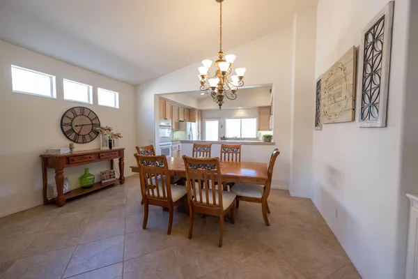 a dining room with furniture and window