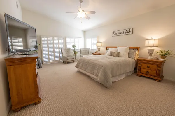 a bedroom with bed and window
