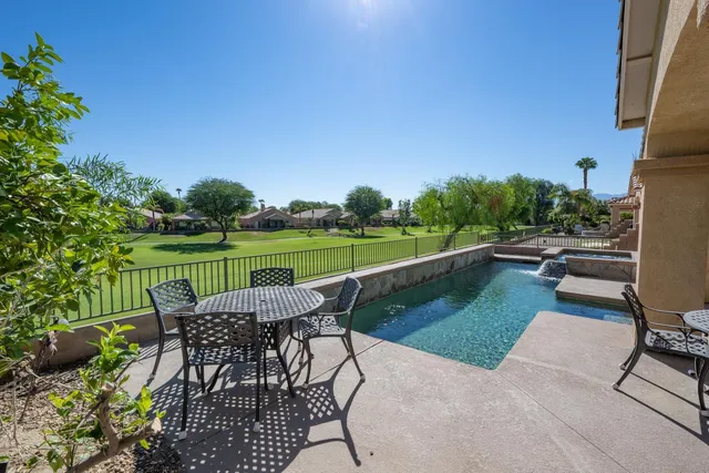 a view of a park with a large trees