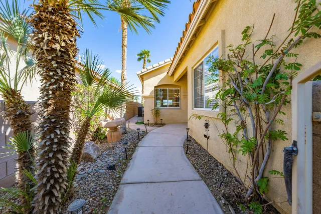 a house with potted plants in front of it