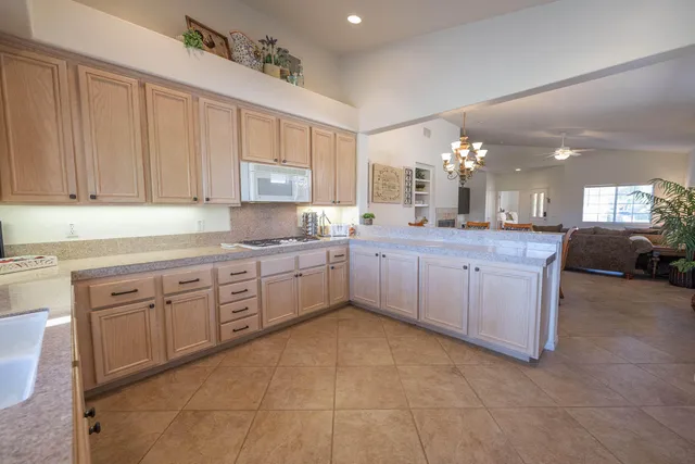 a kitchen with cabinets a sink and appliances