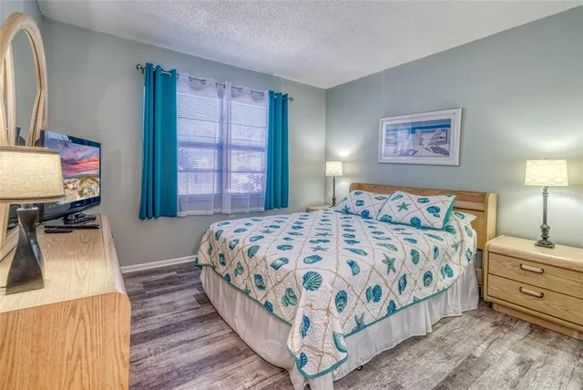 a bedroom with a bed and a dresser