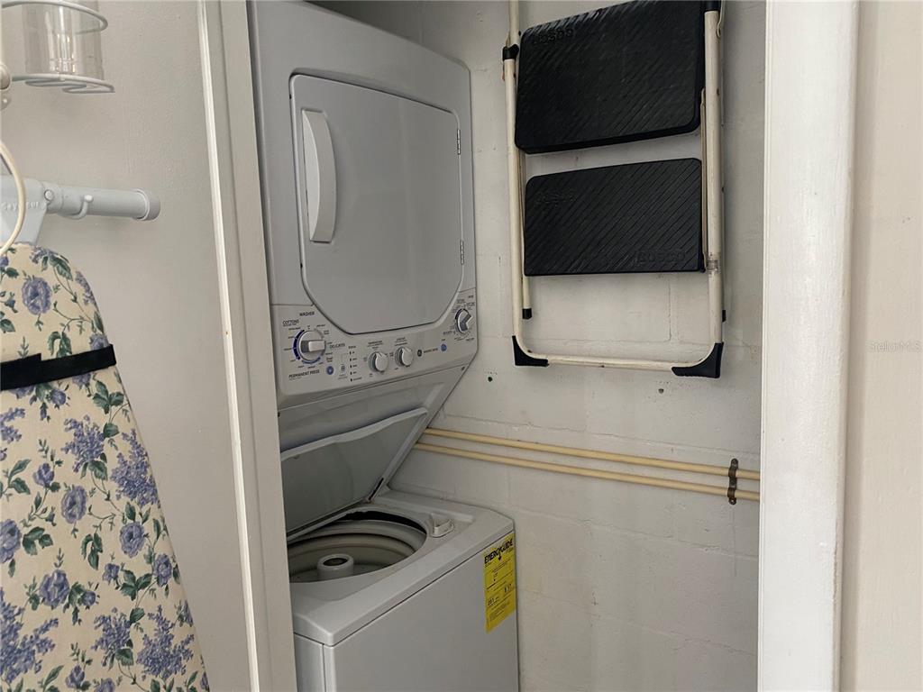 13714 Mission Oaks Boulevard, Unit 13714 Seminole, FL 33776 - Photo 19 of 24 a utility room with dryer and washer