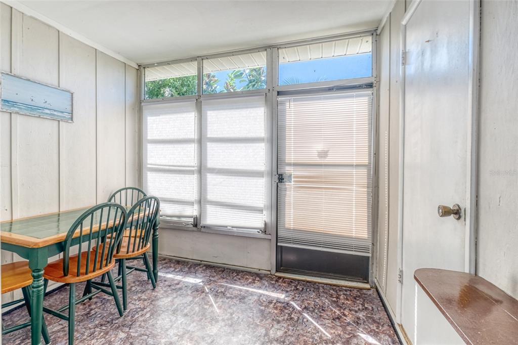 13714 Mission Oaks Boulevard, Unit 13714 Seminole, FL 33776 - Photo 20 of 24 a room that has a bed and a window