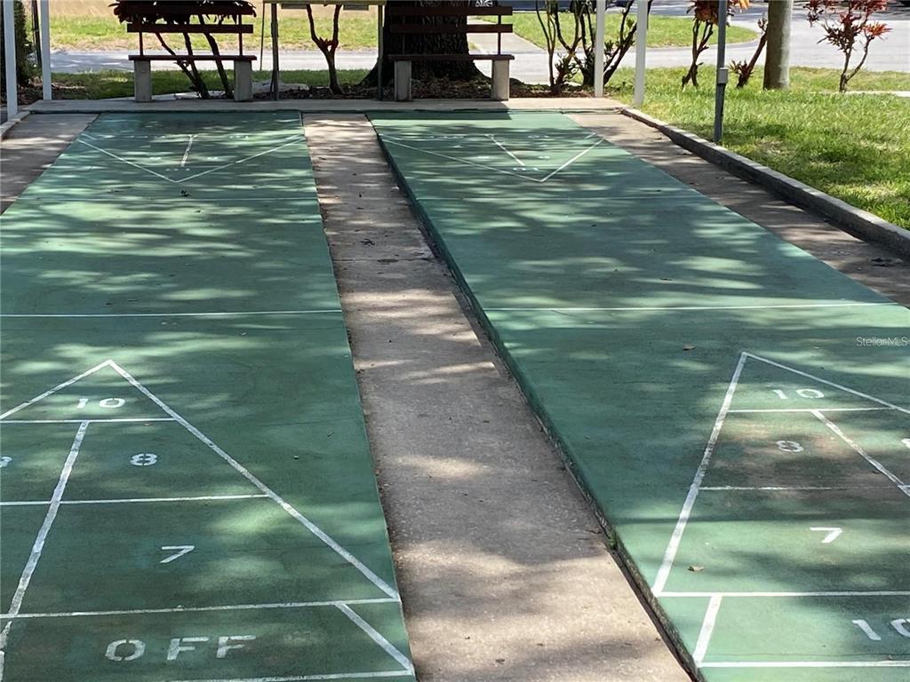 13714 Mission Oaks Boulevard, Unit 13714 Seminole, FL 33776 - Photo 24 of 24 a view of a tennis court