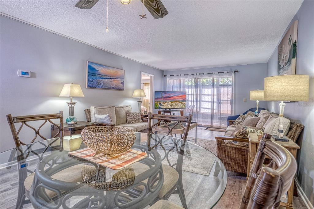 13714 Mission Oaks Boulevard, Unit 13714 Seminole, FL 33776 - Photo 3 of 24 a view of a livingroom and dining room