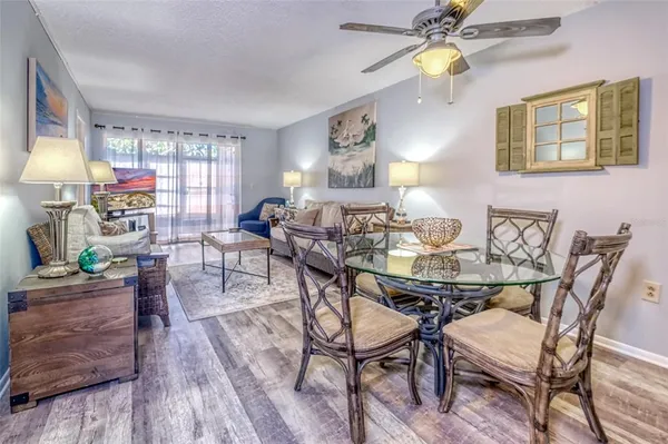 a view of a dining room with furniture and chandelier