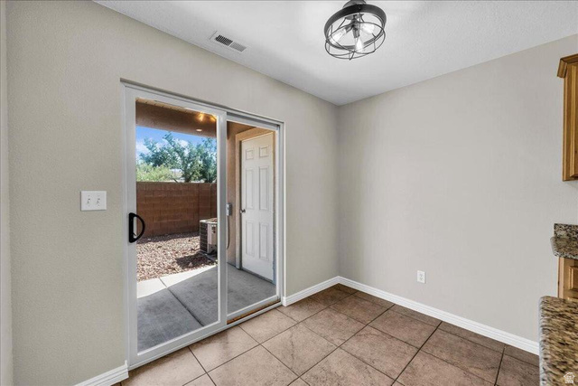 3155 South Hidden Dr Street, Unit 248 St. George, UT 84790 - Photo 7 of 24 Interior space featuring ceramic tile flooring, neutral wall tones, and a contemporary semi-flush mount light fixture
