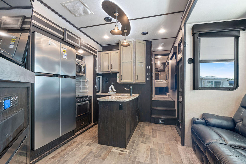 325 Calusa Street, Unit 351 Key Largo, FL 33037 - Photo 12 of 18 a kitchen with cabinets and stainless steel appliances