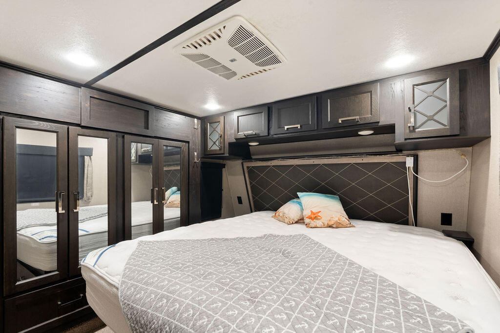 325 Calusa Street, Unit 351 Key Largo, FL 33037 - Photo 14 of 18 a bedroom with a bed and wooden floor