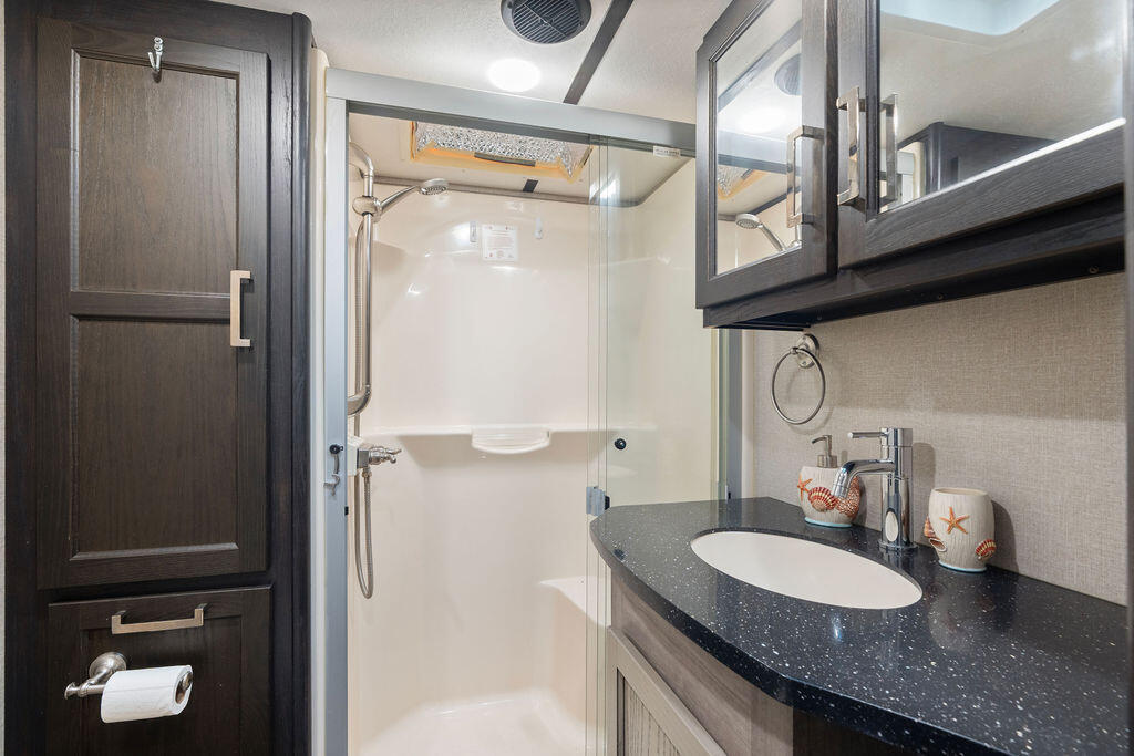 325 Calusa Street, Unit 351 Key Largo, FL 33037 - Photo 15 of 18 a bathroom with a granite countertop sink and a mirror